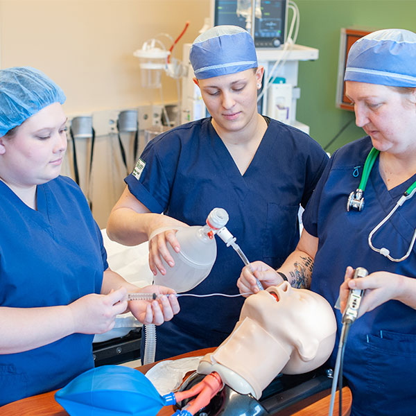 Resp. care students practicing with dummy