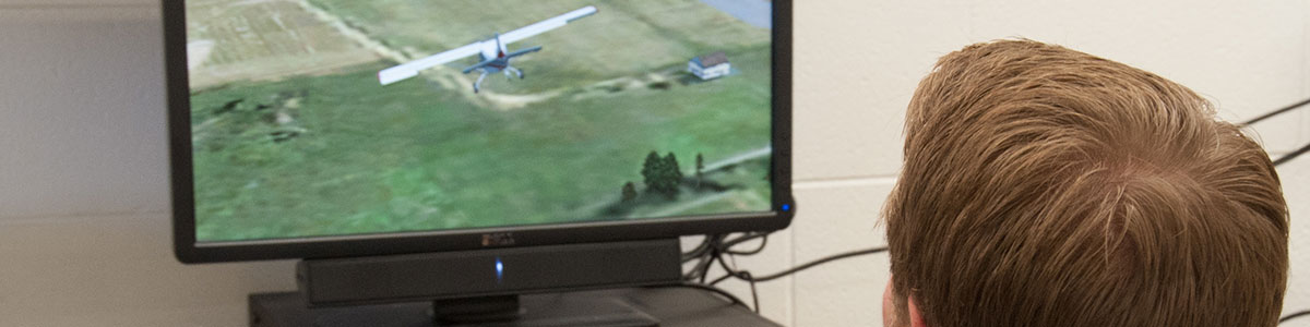 student flying a drone