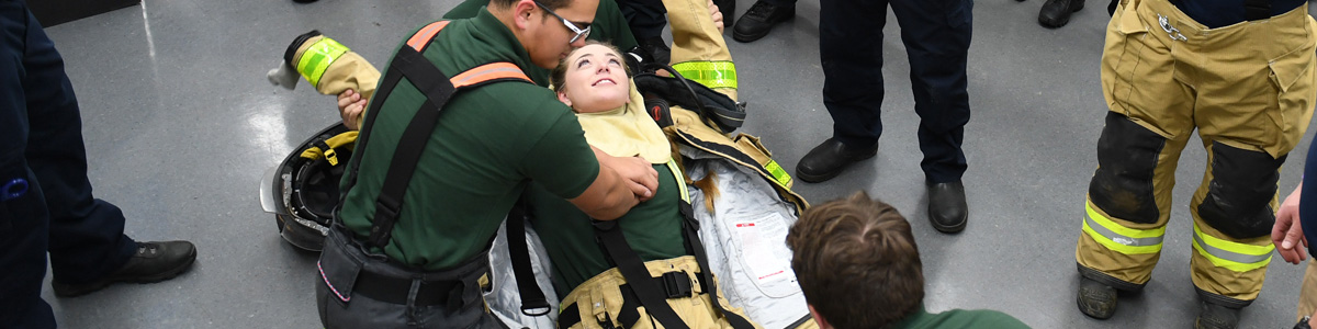 students working over injured