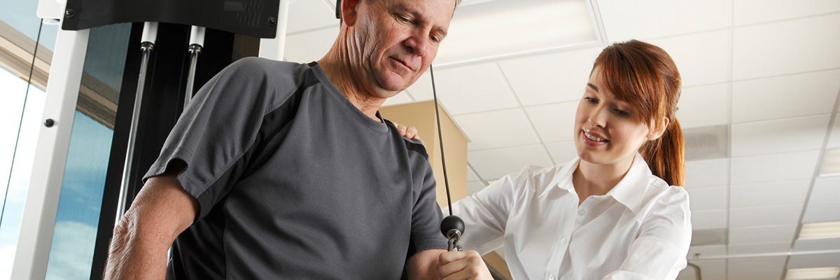 physical therapist working with patient