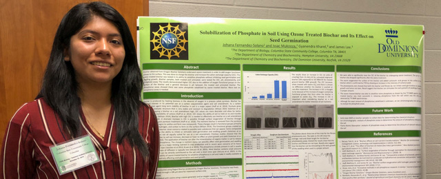 student with research poster