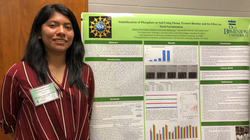 student with research poster