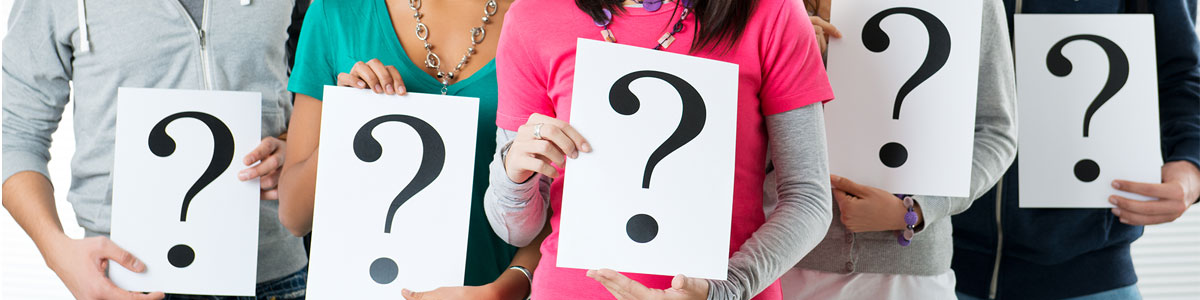 people holding question mark sign