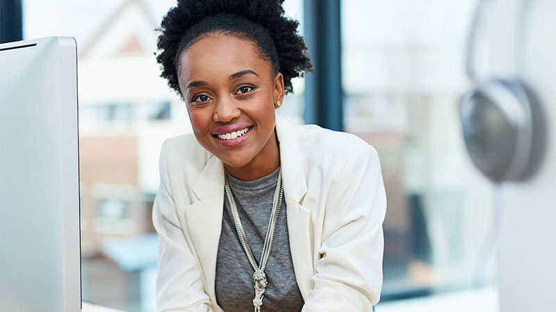 young smiling woman at desk