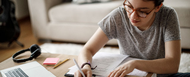student studying with laptop