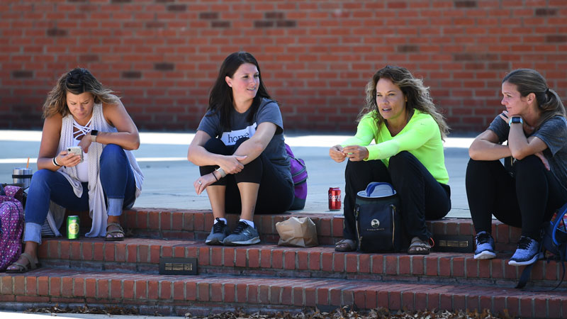 students sitting outside