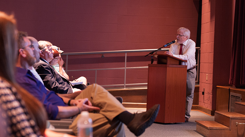 speaker and front row of audience