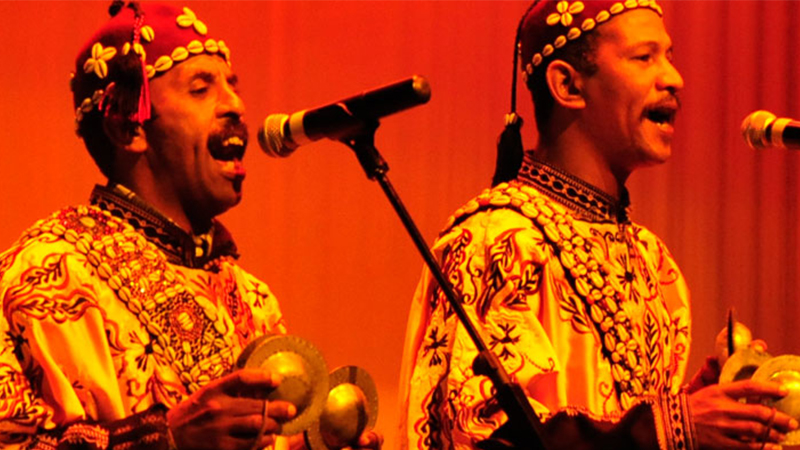 two singers in cultural costume