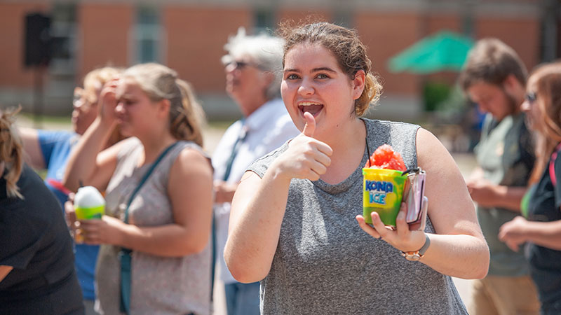 student with sno cone