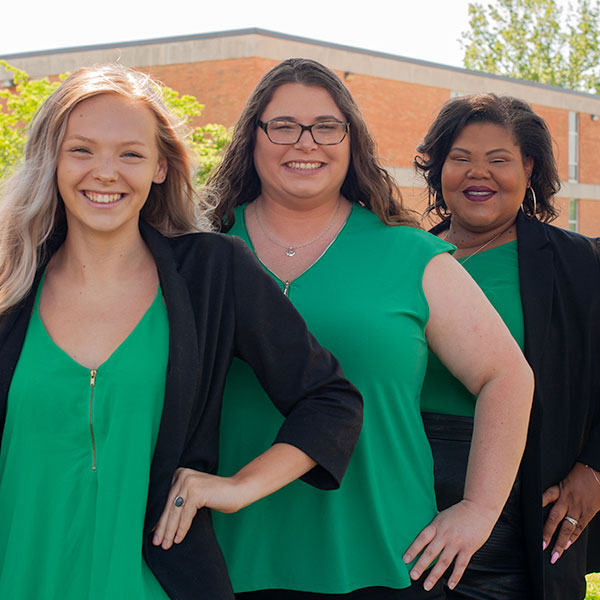 3 SGA students in green