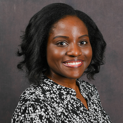 Profile photo of April Wade, a Medical Informatics Program Director, in front of a professional backdrop. 