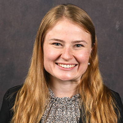 Profile photo of Rachel Tomlinson, Advancement Office administrative secretary, in front of a professional backdrop.