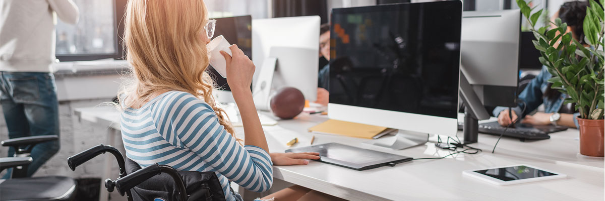 woman in wheelchair at computer