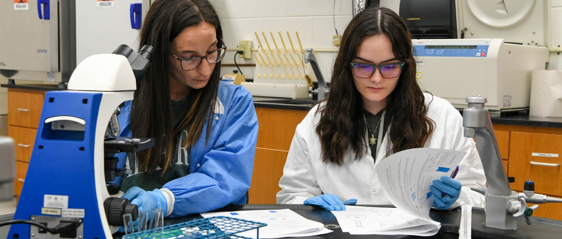 Two nurses working in lab