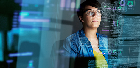 A woman surrounded by floating code in the air