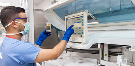 A man using a piece of medical equipment