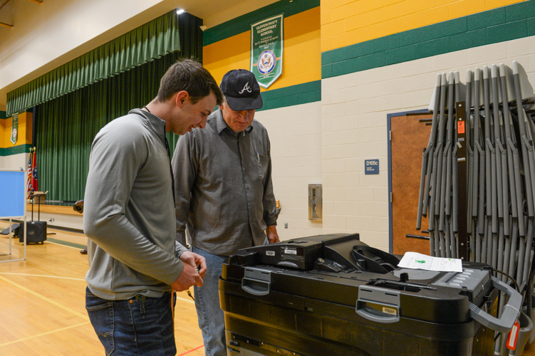 Columbia State student works on election machine