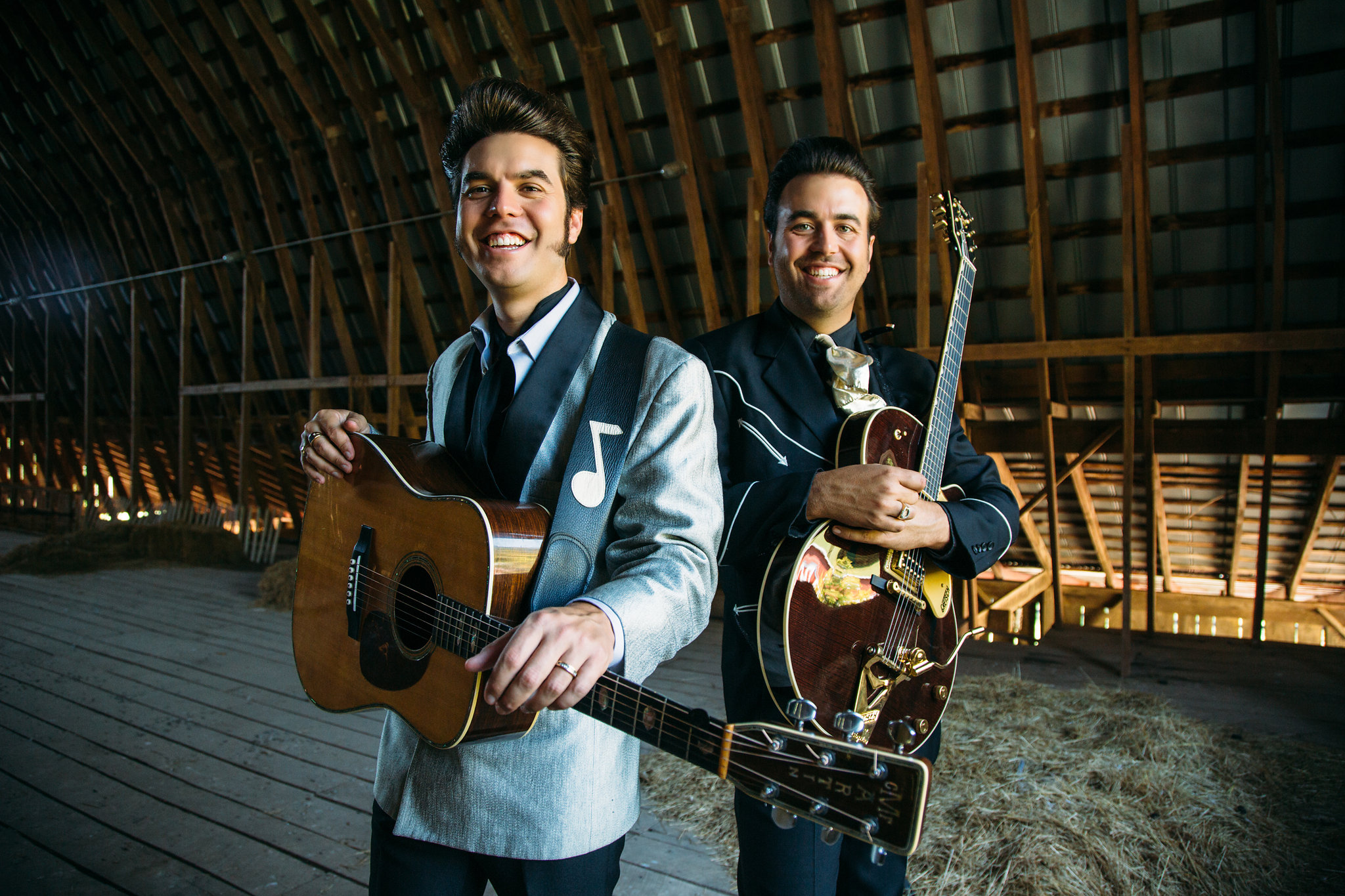 Malpass Brothers hold instruments in a barn loft