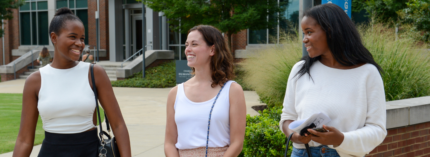 Students laugh outside of Williamson Campus