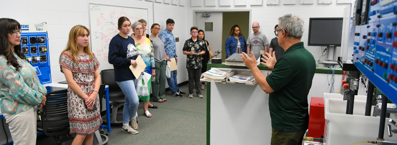 Mehran Mostajir, Columbia State program director of engineering systems technology, addresses students at the NC3 signing day.