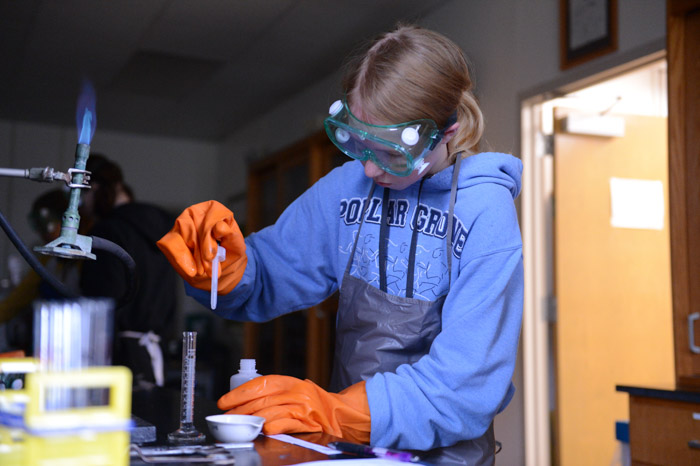 STEM Within Reach, formerly known as STEM GiRLS, attendee conducts flame test.