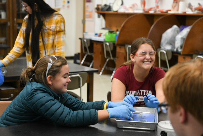 Students participate in cow eyeball dissection at STEM Within Reach. 