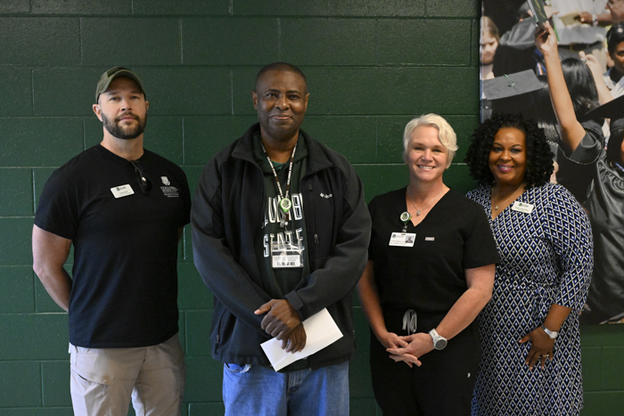 Webster and SVO members pose for a photo