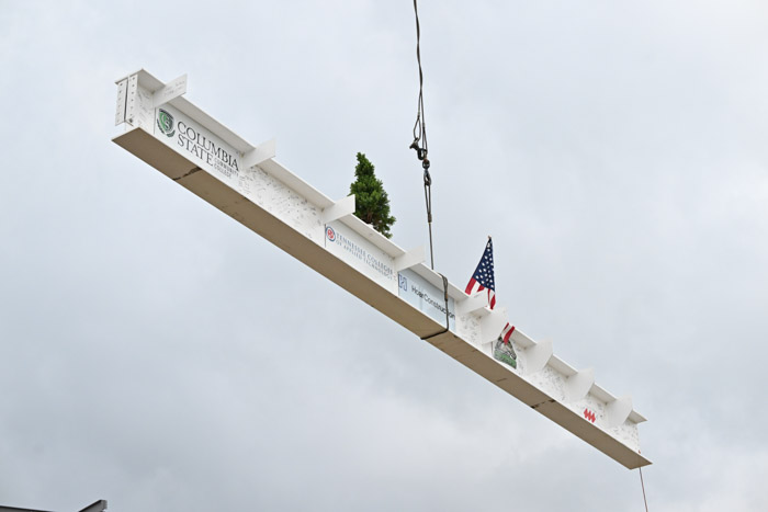 The “Topping Out” beam is lifted in the air on its way to being connected to the SRTC structure.