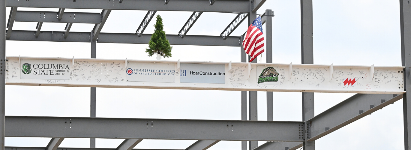 The "Topping Out" beam for the Southern Regional Technology Center is put into place at Columbia State Community College's Columbia Campus.