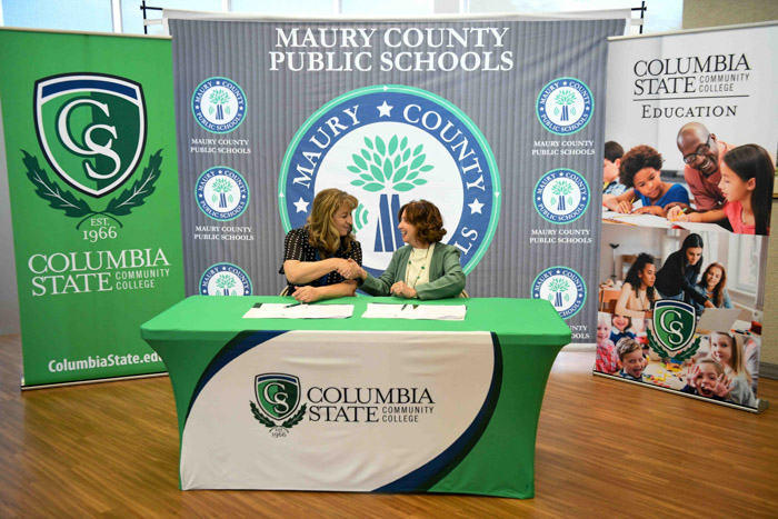 Lisa Ventura, Maury County Public Schools superintendent (left) and Dr. Janet F. Smith, Columbia State president (right) shake hands, solidifying the pre-apprenticeship education program partnership.