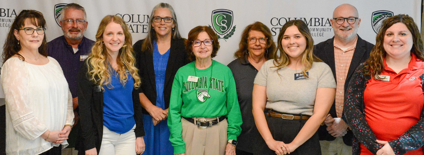 Dr. Janet F. Smith, Columbia State president (center), stands with several university representatives who attended the summit.
