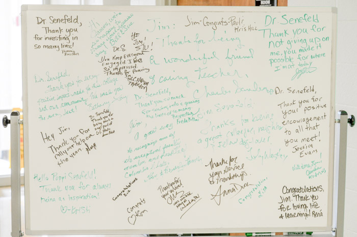 Thank you notes from family, friends and colleagues are left for Dr. James Senefeld outside of the Clement 114 classroom dedicated to him.