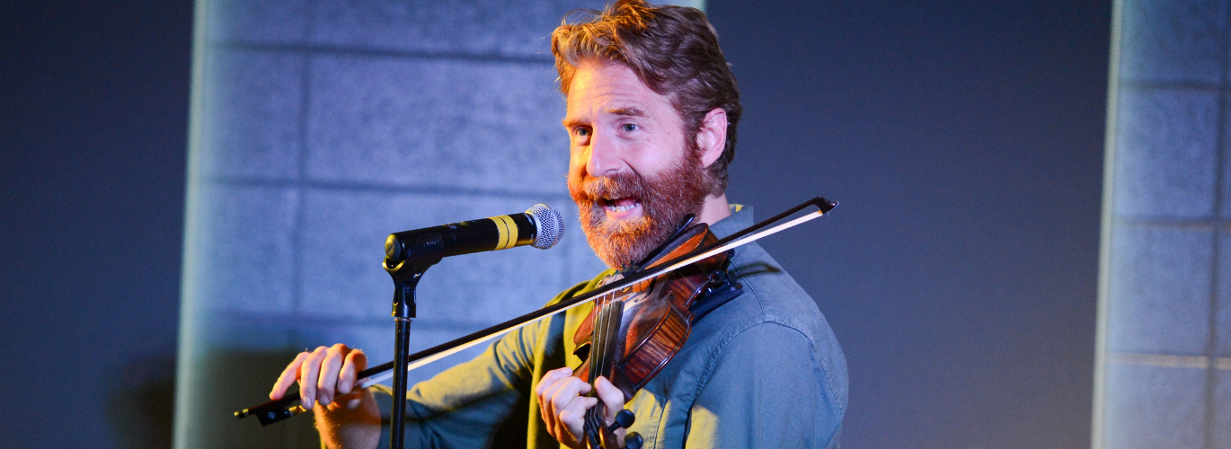 Sean "Sean of the South" Dietrich plays the violin at the Columbia Campus library.