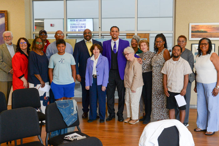 A large group of people are standing for a photo.