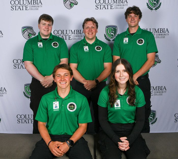 A group of people pose for a photo.