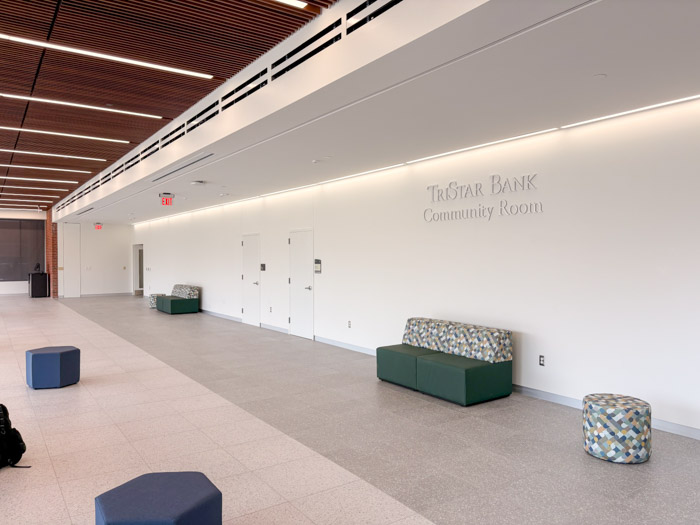 A large room with white walls with the words "TriStar Bank Community Room" written on it.