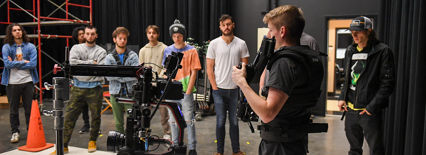 FCT students look at a camera build