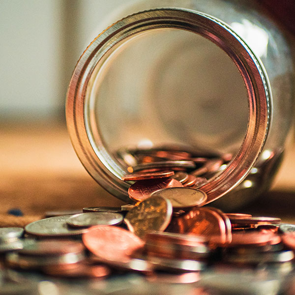 tipped over jar of coins