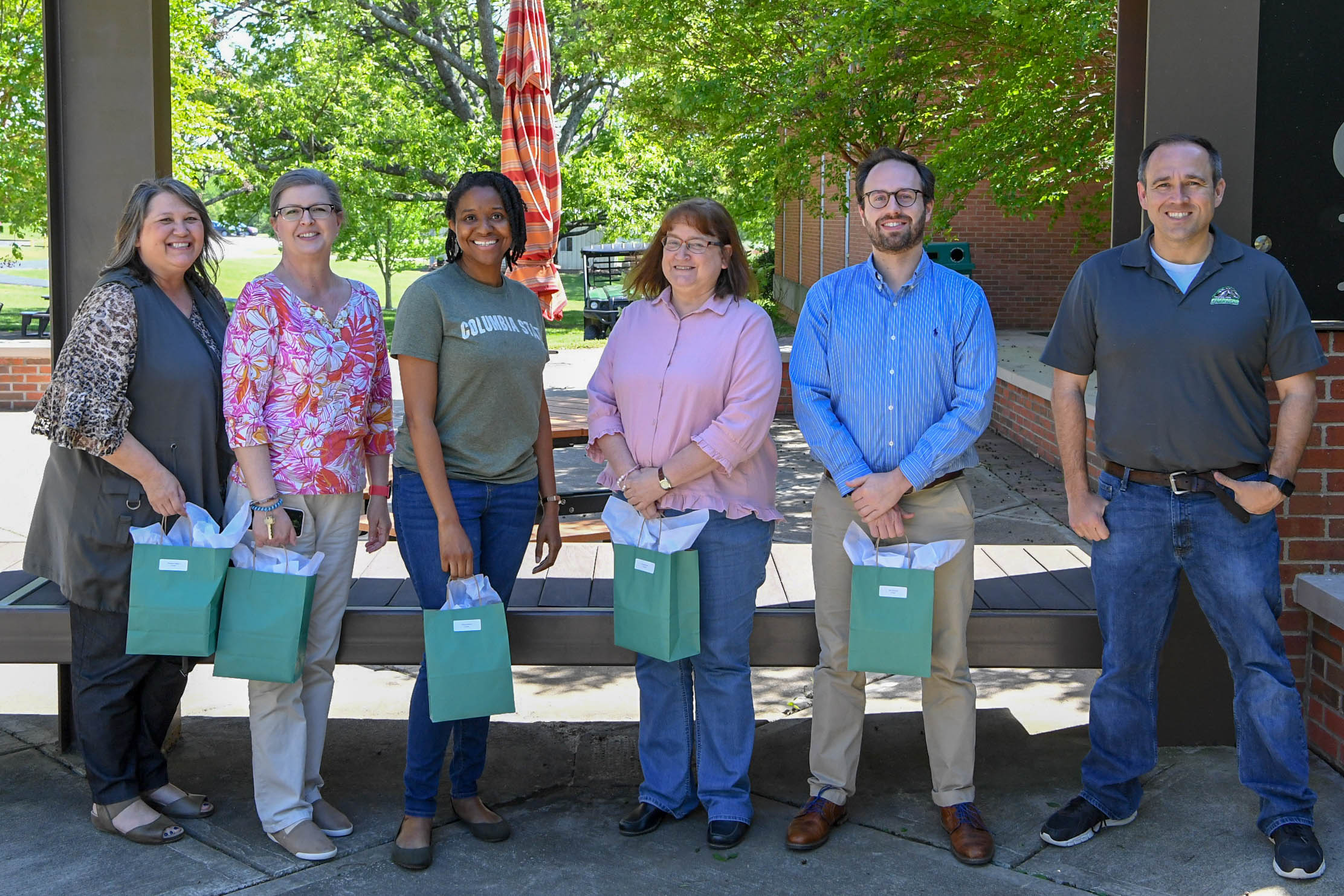 5-year service award recipients stand for a photo