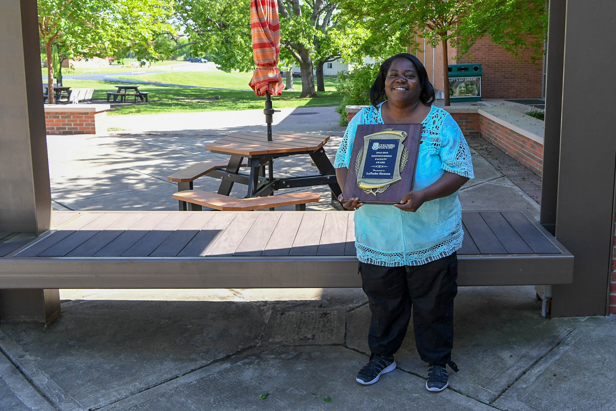LaTasha Stenson present the distinguished faculty award