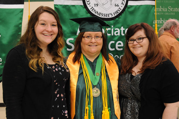 Female graduate with daughters