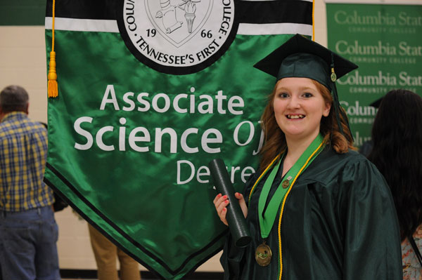 Young female graduate on stage