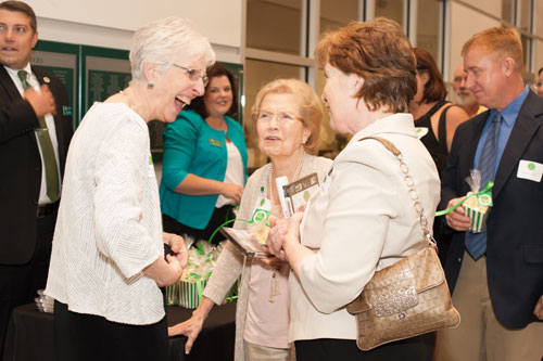 Three ladies talking with popcorn