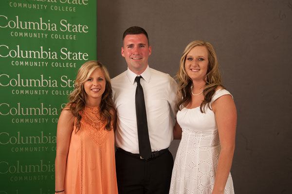 Two girls and a guy smiling