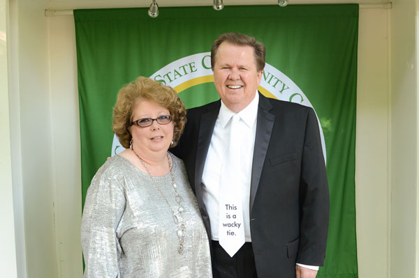 Woman and man posing for photo