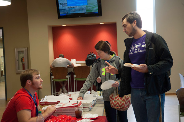 Columbia State students talk SkillsUSA and eat pizza. 