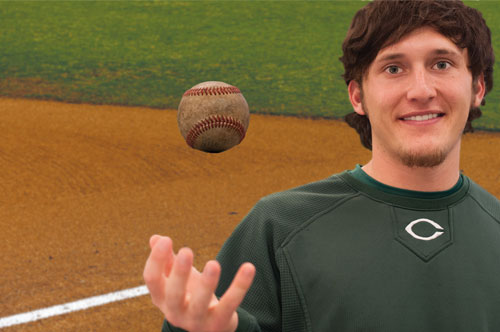 Baseball player tossing a ball.