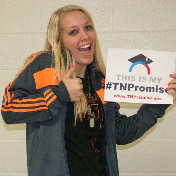 smiling student with TN Promise sign