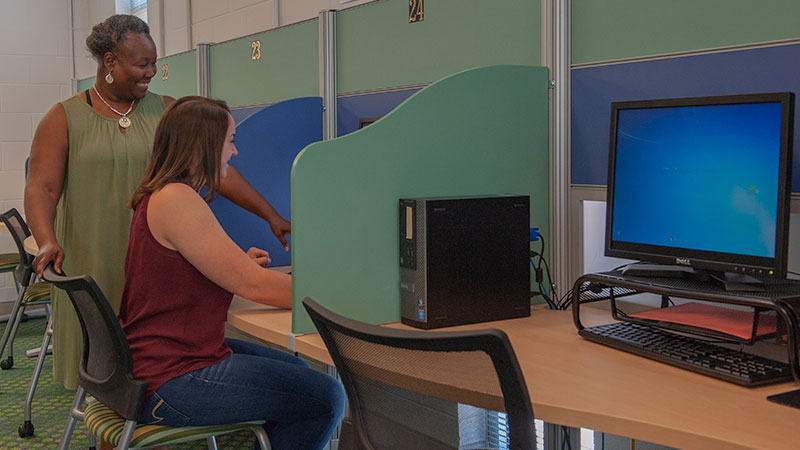 helping a student in testing lab